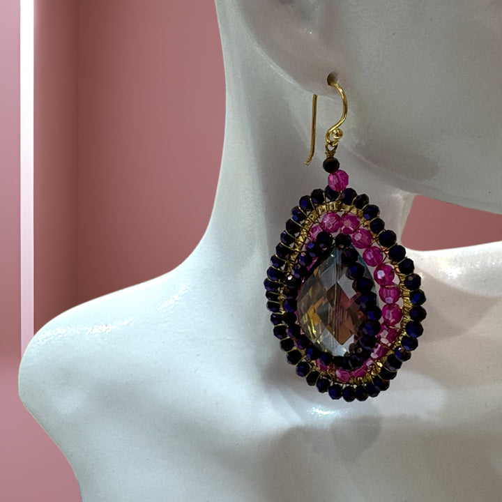 Le Mélange Luxe earrings adorned with multiple colored crystals.