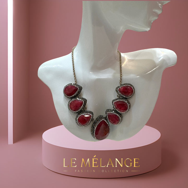 Elegant sterling silver necklace embellished with rubies and Swarovski crystals.