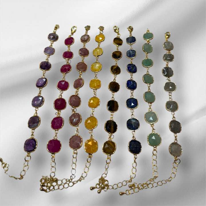 Gold-plated bracelets with gemstones.