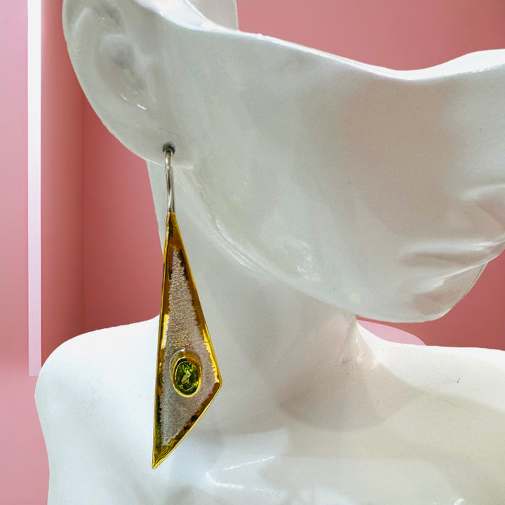 Artisan geometric silver and 24 karat overlay gold earrings with a "" gemstone.